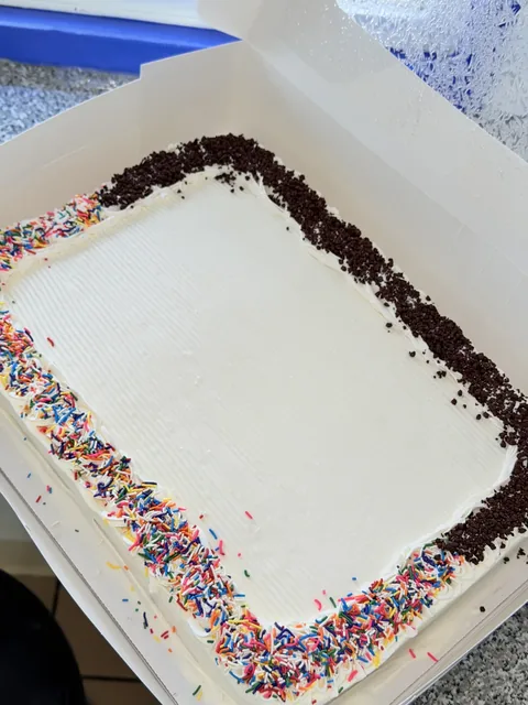 Rectangular ice cream sheet cake with chocolate crunch border
