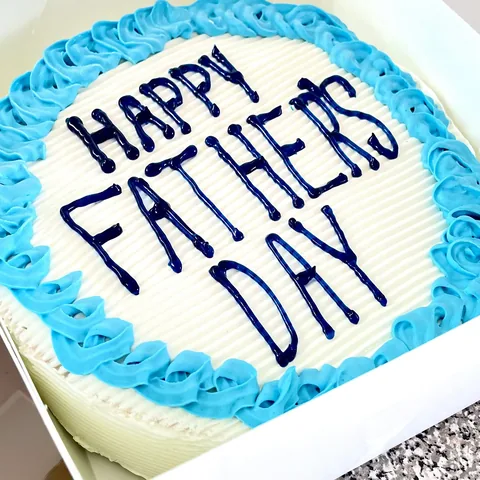 Father's Day ice cream cake with blue frosting border