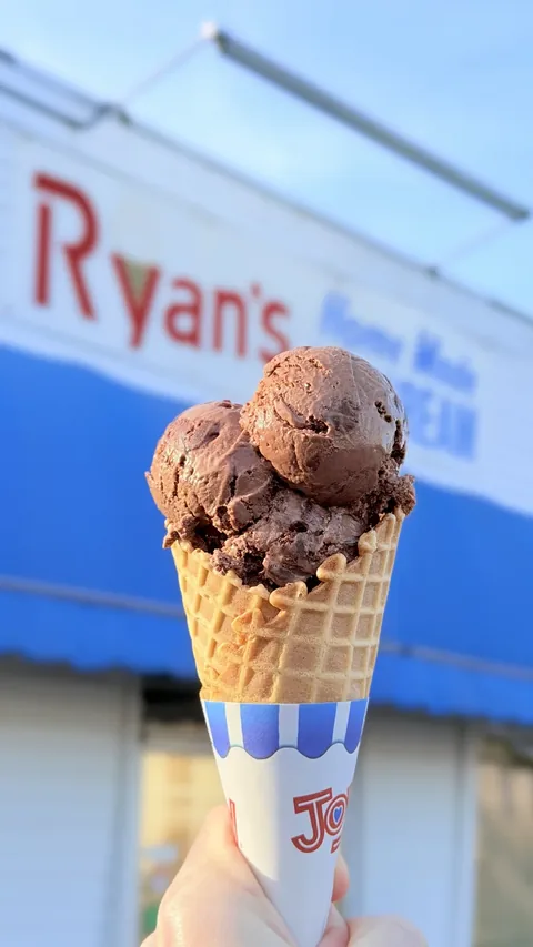 Double scoop of homemade fudge brownie ice cream on a waffle cone