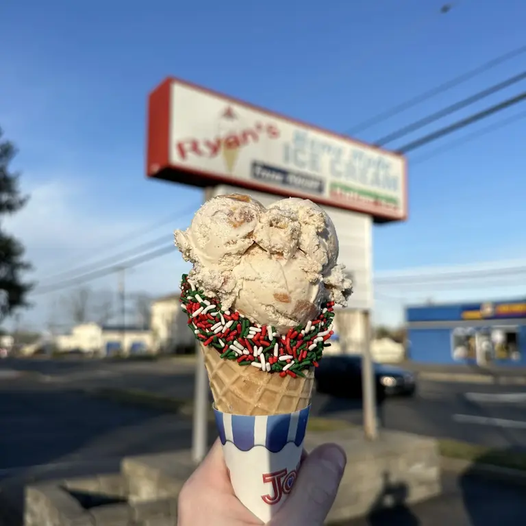 Chocolate dipped cone with holiday sprinkles outside Ryan's