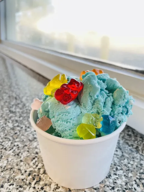 Blue raspberry ice with gummy bears in a cup