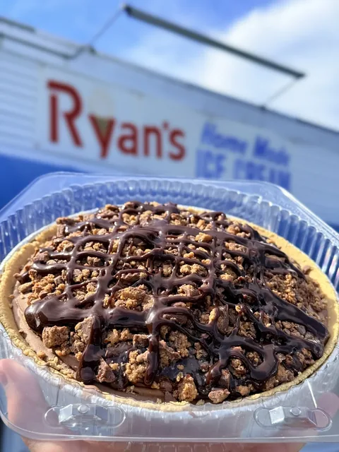 Peanut butter cup ice cream pie with chocolate drizzle