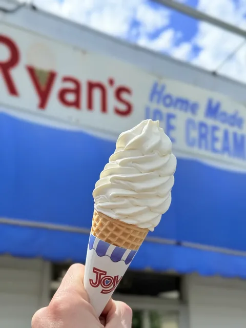 Classic vanilla soft serve swirl on a cone